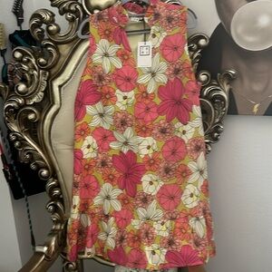 . NWT. About knee length, light wight, has a lining and a flounce